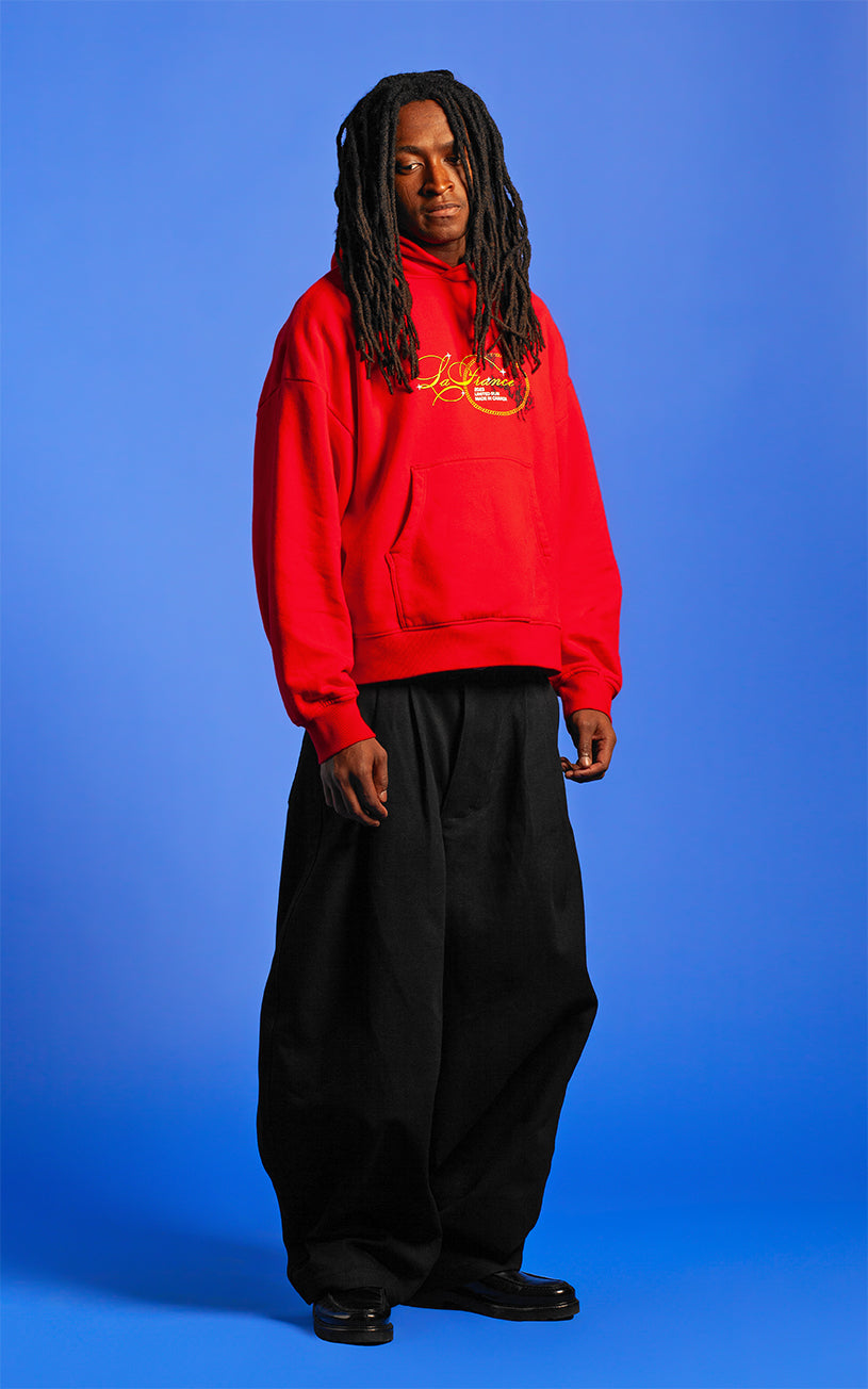 LaFrance Cropped Red Stampede Hoodie & Black Pleated Denim